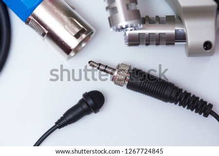 Lavalier microphone with audio plug close up view on white background