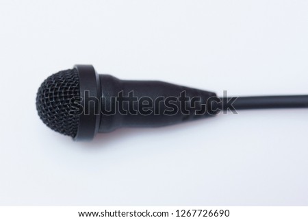 Lavalier microphone close up view on white background
