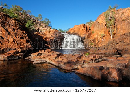 Small waterfall and pool with clear water, Kakadu National Park, Northern Territory, Australia Royalty-Free Stock Photo #126777269