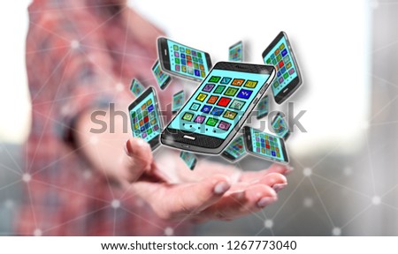 Apps concept above the hand of a woman in background