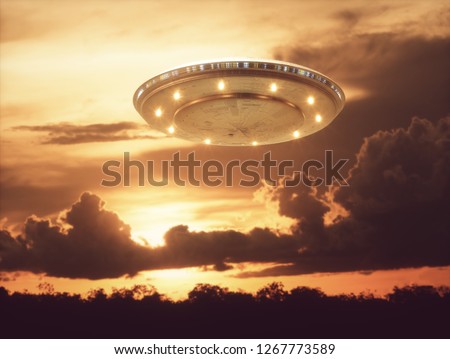 Unidentified flying object, UFO with the sunset in the background. 