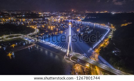 aerial view of Sungai Kebun Bridge with the water village at Bandar Seri Begawan, Brunei Darussalam. night shot Royalty-Free Stock Photo #1267801744