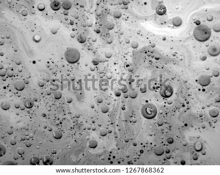 abstract art background.oil and water.Free movement of white and black.The texture of the surface is mixed with water and acrylic and oil. The abstract image is in the form of free white and black.