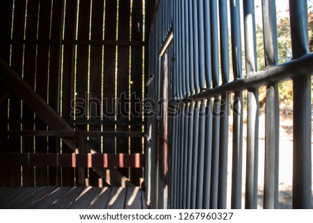 Lines Created By Metal Bars, Wooden Slats, and Shadows