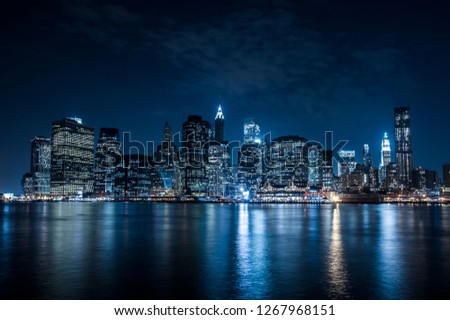 Manhattan, New York city at night view from Brooklyn. 