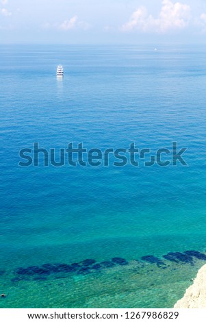 steep cliffs, pine trees, yacht in the clear sea, the coast of Gelendzhik, the beach " Sosnovka"
