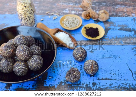 Maqui berry energy balls with quinoa, fig, sunflower seed and coconut flakes