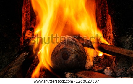 burning coconut shell face