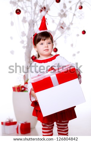 girl in a red suit with a white gift