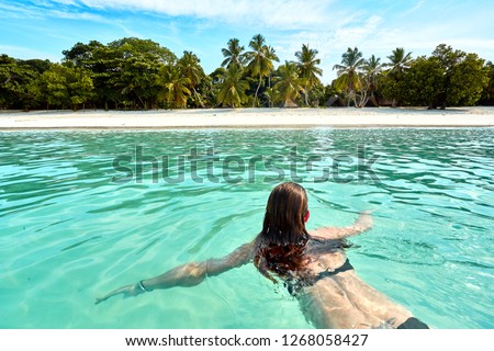 woman swimming at the beach nosy iranja Royalty-Free Stock Photo #1268058427