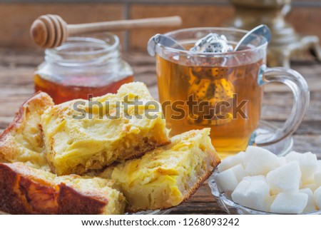 Tea with apple pie and bee honey in the village