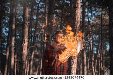 guy in the woods, camping, guy with fire	

