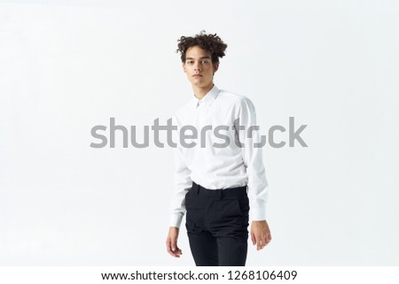 Stylish man in a suit on a light background  