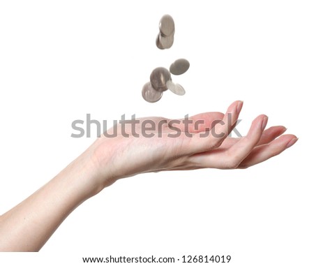 a male hand with falling coins on a white background
