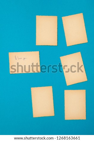 Old vintage paper set on the blue background. A lot of advertising notes as old photos.