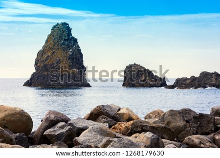 Acitrezza rocks of the Cyclops, sea stacks in Catania, Sicily, Italy.