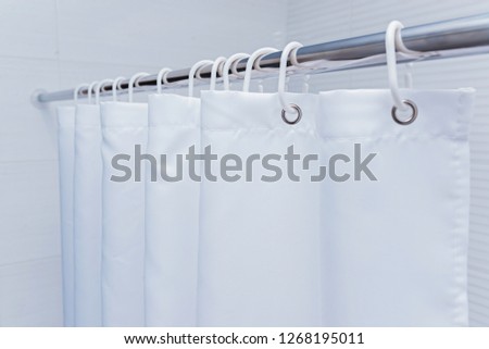 White bathroom with black and white shower curtain. Royalty-Free Stock Photo #1268195011