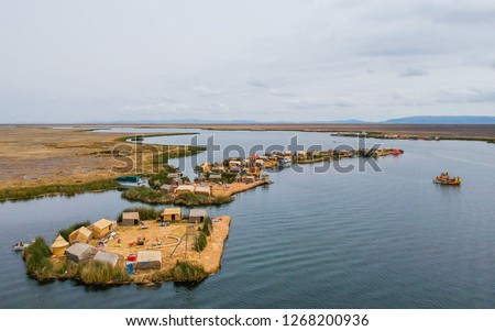 Uros Floating Islands on Lake Titicaca from a bird eye view (drone) Royalty-Free Stock Photo #1268200936