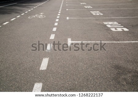 bus parking note sign on asphalt
