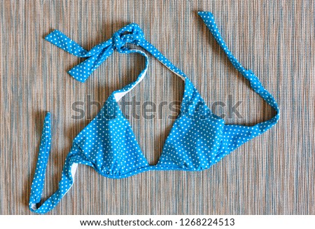 flat lay of blue swimming suit