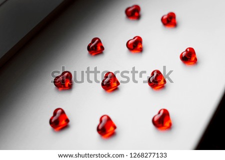 Top view of red hearts on white background, St. Valentine's Day concept.