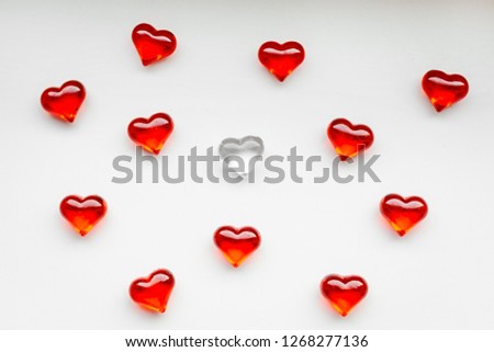 Top view of red hearts on white background, St. Valentine's Day concept.