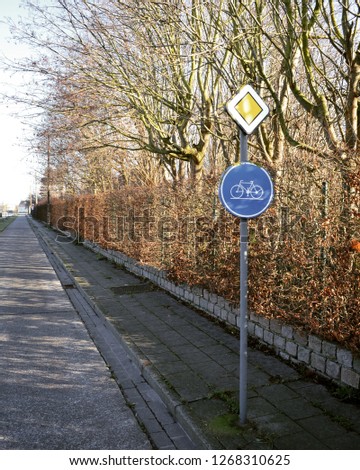 european bicycle path next to trees