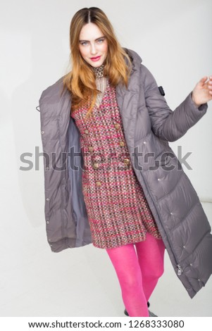 Beautiful model posing in a downcoat
