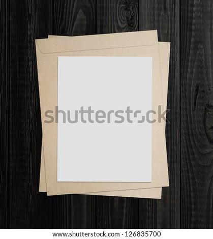 blank white poster on a wood wall