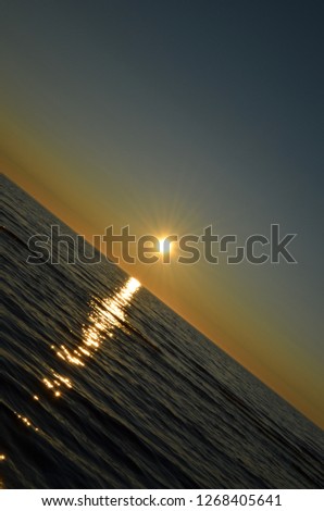 beautiful sunset on the shore of lake Onega in the summer evening