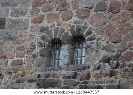 stonework windows of a medieval wall