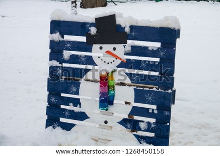 New year and Merry Christmas Winter background, The Winter Snow Field with Snowman. Navy blue.