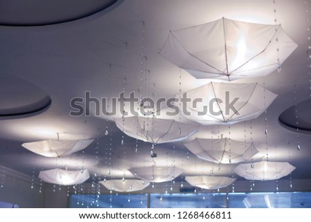 White umbrellas on the ceiling