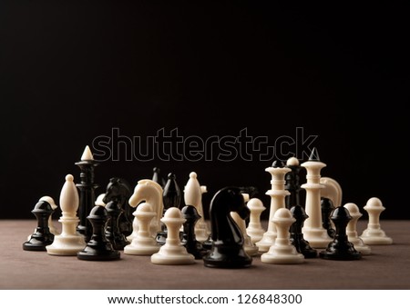 all chess pieces on table background