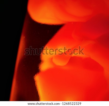 "Creature of light", alien fetus, in a liquid, under glass