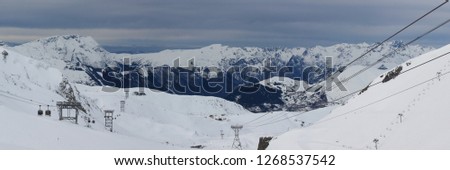 Panorama of ski slope and moutains covered of snow in the 2 Alps, France