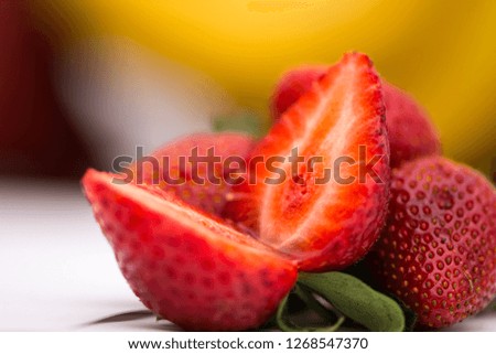 The ripe and red strawberries on the table 