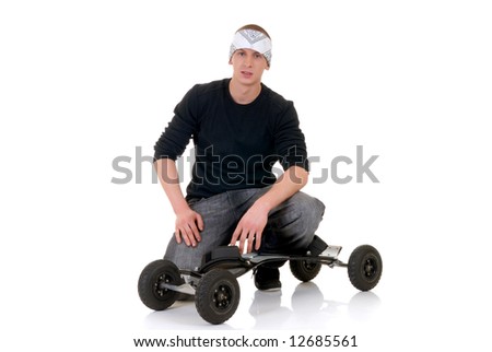 Handsome youngster, teenager posing with skateboard, mountain-board,  white background