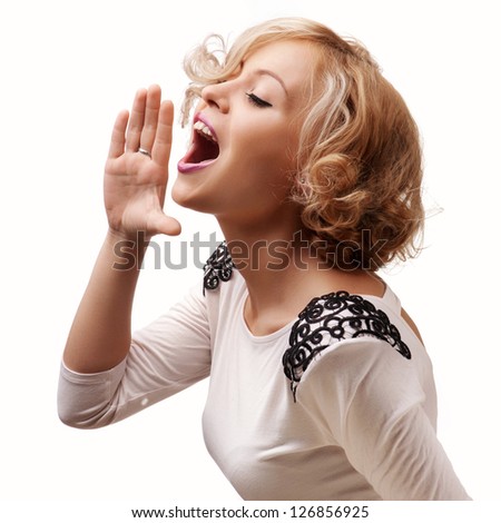 young blonde woman shout and scream using her hands as tube, studio shoot isolated on white Royalty-Free Stock Photo #126856925
