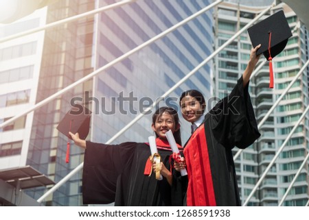 Asian female graduated student posing for photography after graduation