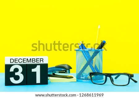 December 31st. Image 31 day of december month, calendar at New year date on workplace background