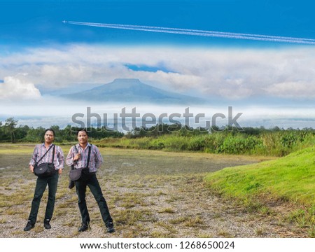 The abstract soft blurred and soft focus double men with the blue sky cloud viewpoint , Thailand fuji's mountain.