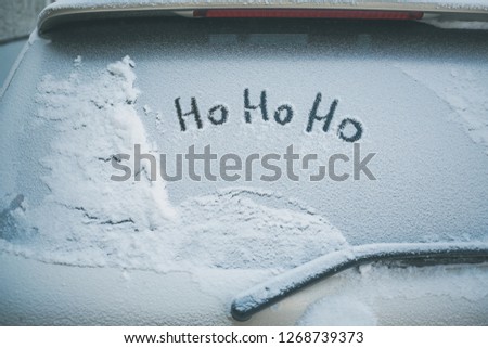 hohoho inscription on the rear window of the car