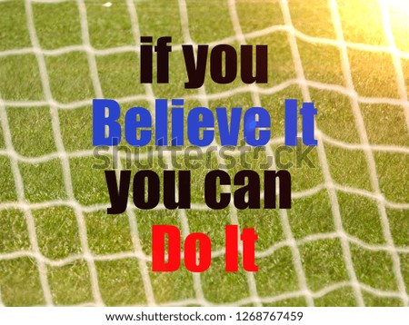 Soccer Goal Net and words IF YOU BELIEVE IT YOU CAN DO IT on Green Grass Background with selective focus and crop fragment. Business and motivation concept