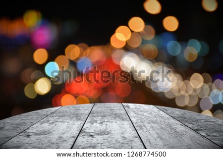 Empty wooden table and bokeh background 