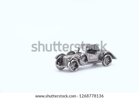 models of retro cars in miniature on white background
