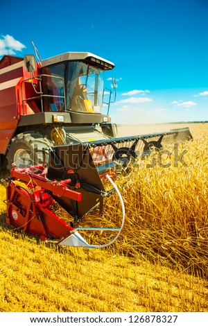 combine harvester close up Royalty-Free Stock Photo #126878327