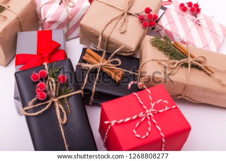 Modern gifts on a white table with copy space. Christmas background. Flat lay