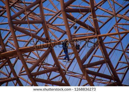 worker in construction site during day time.construction workers outdoor on daytime.structure steel.