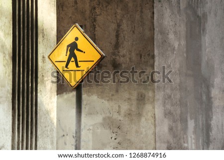 Signboard yellow Signs for Pedestrians in Urban Bangkok city Thailand, Symbol Warning Sign at Crosswalk for Safety Pedestrian Walk
